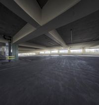 the empty parking garage with multiple concretes in it and no one on the ground