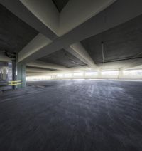 the empty parking garage with multiple concretes in it and no one on the ground