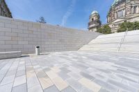 a view from the ground looking down at an outside area and steps in front of a building