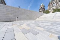a view from the ground looking down at an outside area and steps in front of a building