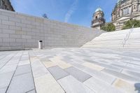 a view from the ground looking down at an outside area and steps in front of a building