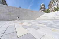 a view from the ground looking down at an outside area and steps in front of a building