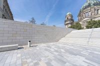 a view from the ground looking down at an outside area and steps in front of a building