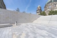 a view from the ground looking down at an outside area and steps in front of a building