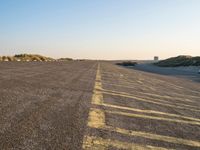 Peaceful Dawn in Holland: Beach, Ocean, and Road