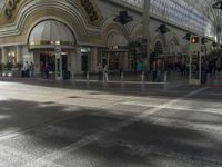 people standing around in a mall with an open floor plan to sit, walk, and watch a display