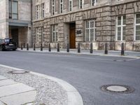 an image of some people on skateboards by buildings and sidewalks in the city