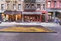 the sidewalk on the city side shows that people are walking outside of the shop front and shopping