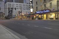 a city street lined with tall buildings in the evening hours with traffic passing by and oncoming, cars drive past and driving in front