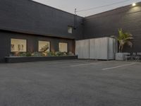 this is an empty, but tidy office building with dark paint and concrete walls and doors