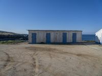 Picturesque Coast in Portugal: Sandy Shore and Buildings (003)