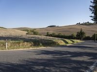 Picturesque Tuscany Road Through Rugged Hills