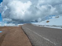 a person is on the top of a ramp on a steep hill by the ocean