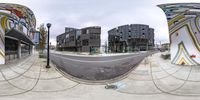 a fish eye view showing streets and buildings in the background while being in motion around them