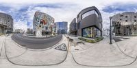 there is a fisheye view of the street in front of the shopping center, on the other side of the road