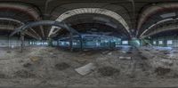 the panoramic image shows an abandoned warehouse interior that was demolished and stripped down