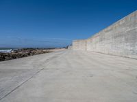 Porto Beach View: The Ocean and Concrete Wall