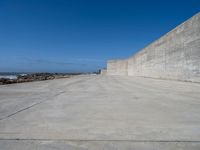 Porto Beach View: The Ocean and Concrete Wall