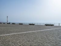 Porto's Coastal Parking Lot: Cobblestone Views