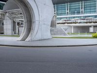 this is an image of a city street in singapore with buildings, walkways and curved sidewalk