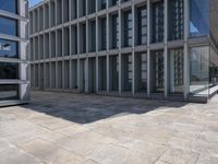 a large building with several windows and no people outside it, along with some stairs