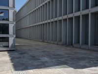 a large building with several windows and no people outside it, along with some stairs