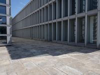 a large building with several windows and no people outside it, along with some stairs
