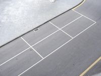 a paved road near the side of a street with a car driving by it,