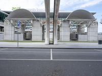 an empty car park near a modern architecture design terminal at an airport in the city