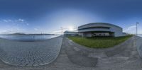 there is a fisheye lens photo showing how big this building is in the water