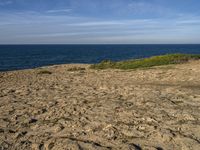 Portugal Beach: Relaxing on the Sandy Shores with a Clear Sky and an Ocean View