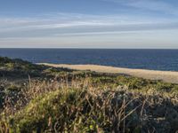 Portugal's Beach: Sand, Water, and Clear Skies