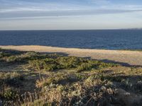 Portugal's Beach: Sand, Water, and Clear Skies