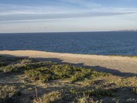 Portugal's Beach: Sand, Water, and Clear Skies