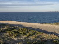 Portugal's Beach: Sand, Water, and Clear Skies