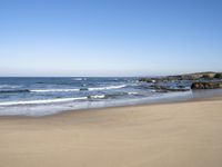 the beach is clean and empty on a sunny day with no people or animals in it