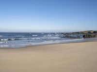 the beach is clean and empty on a sunny day with no people or animals in it