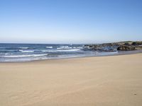 the beach is clean and empty on a sunny day with no people or animals in it