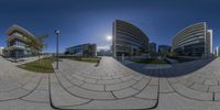 an image taken from within a 360 - camera lens of buildings on the waterfront outside a large city area