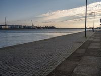 Portugal's Coastal Harbor: Cobblestone Pier Views