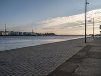 Portugal's Coastal Harbor: Cobblestone Pier Views