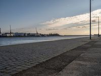 Portugal's Coastal Harbor: Cobblestone Pier Views