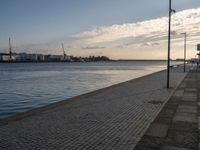 Portugal's Coastal Harbor: Cobblestone Pier Views