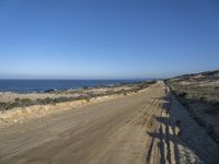 Portugal's Coastal Plain: Azure Waters and Sunlit Skies