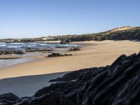 Portugal's Coastal Landscape: Sunlight and Azure Water