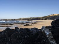 Portugal's Coastal Landscape: Sunlight and Azure Water