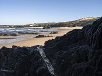 Portugal's Coastal Landscape: Sunlight and Azure Water