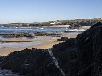 Portugal's Coastal Landscape: Sunlight and Azure Water