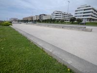 an empty city street with a bench in front of it in a commercial area for people