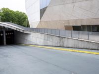 a street sign indicating the way of a parking lot with a fire hydrant at the end